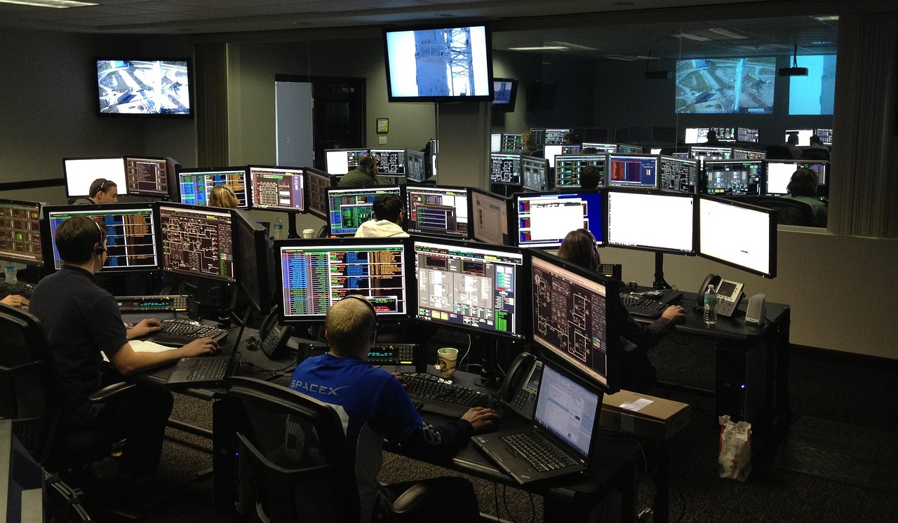 Cybersecurity analysts monitoring security dashboards at The Cyber Arm Security Operations Center in Toronto